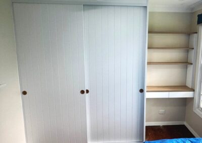 Pinstripe sliding door wardrobe with Study desk